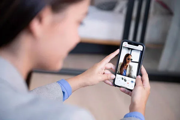 FittingBox eyewear virtual try-on shown on a mobile device